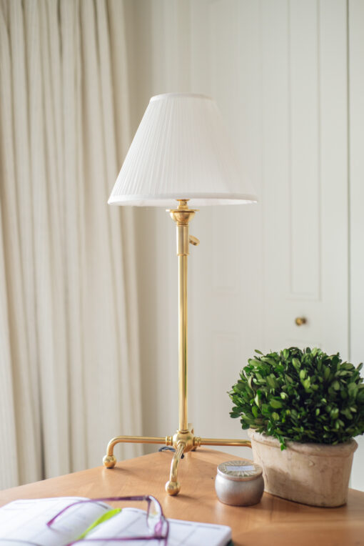 Table lamp with silk shade and gold lamp base