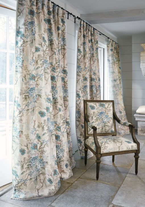 floral fabric on curtains and upholstered chair